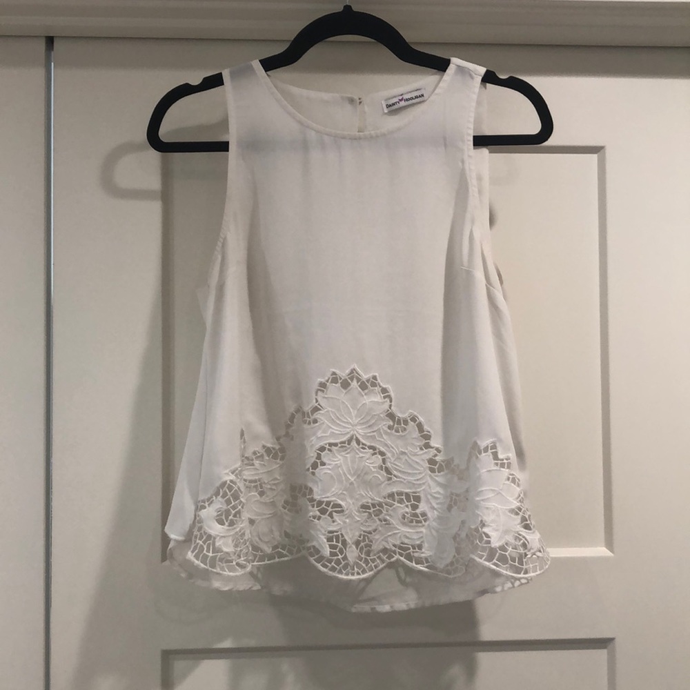 White sleeveless blouse